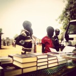 Kids buying books by the Church